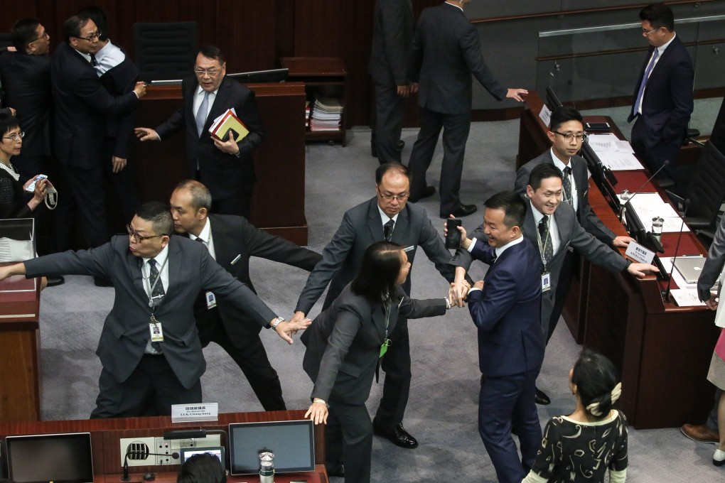 Lawmakers clash during the Legislative Council’s presidential election session, in just one of many angry exchanges at yesterday’s meeting. Photo: Sam Tsang