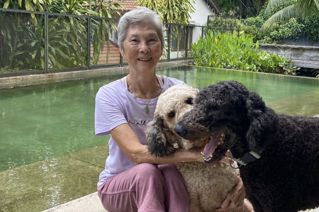 Marguerite Brodie with her dogs Kermit and Moe in Kuala Lumpur. Thanks to decades of dancing and tennis, Rolfing and daily Dharma practice, she stays fit and healthy. Photo: Lise Floris