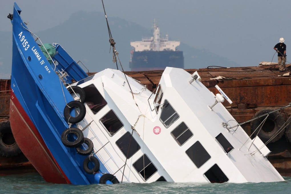 The Lamma IV which was partially sunk in the waters off Lamma Island is lifted up from the sea. Photo: Sam Tsang