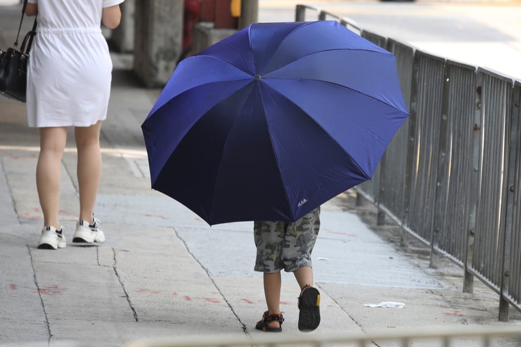 A child carries a large umbrella in Kowloon City, in September 2020. Children will not be properly respected until, like adults, they fully enjoy the protections of the criminal law. Photo: Nora Tam