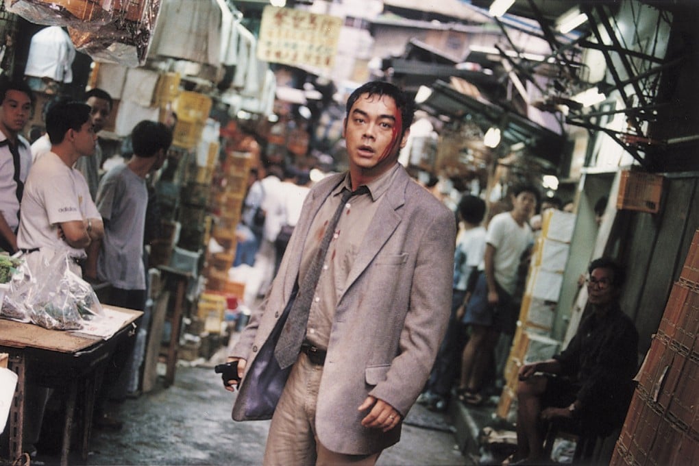 Lau Ching-wan hunting down an escaped robber in the mean streets (Bird Street) of Mong Kok in Ringo Lam’s 1997 movie Full Alert.