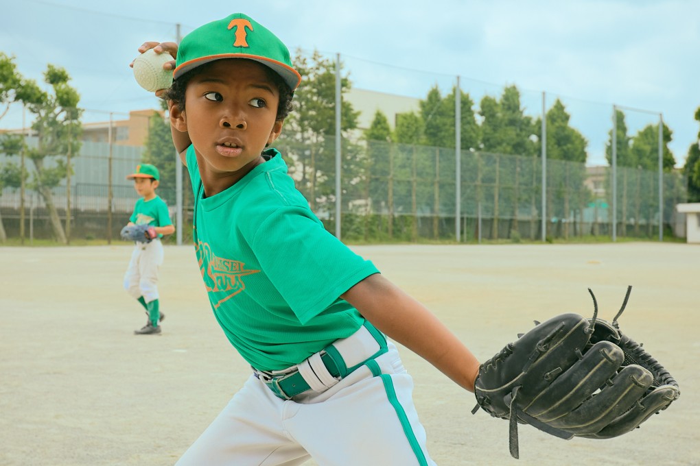 A biracial boy plays baseball in Japan, a country researchers say is beginning to grapple with the microaggressions that are so prevalent in its society towards members of marginalised groups, such as minority races. Photo: Getty Images