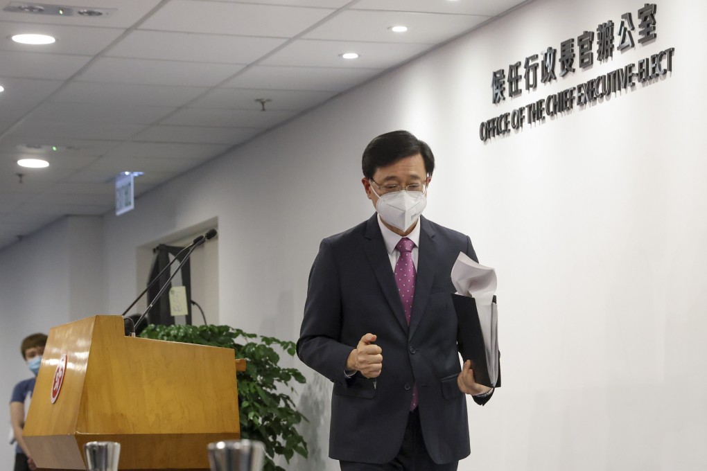 John Lee leaves the Press Room of the Office of the Chief Executive-elect at Immigration Tower in Wan Chai on May 17, after speaking to media representatives about plans for the government restructuring. Photo: Nora Tam