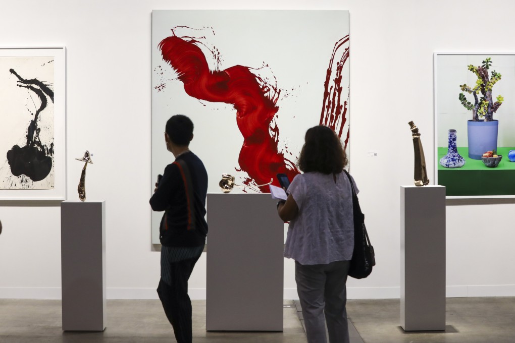Visitors study exhibits during a private viewing at Art Basel Hong Kong, at the Hong Kong Convention and Exhibition Centre in Wan Chai, on May 26. Photo: Jonathan Wong