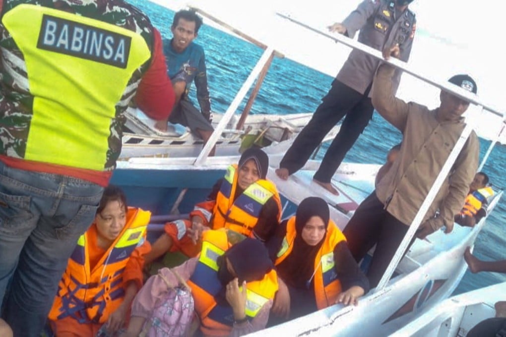 The Indonesian Search and Rescue Agency evacuating some survivors after a passenger ferry sank. Photo: AFP