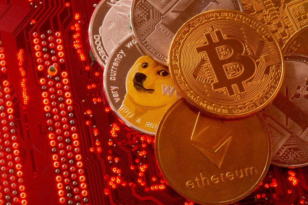 Representations of cryptocurrencies Bitcoin, Ethereum, DogeCoin, Ripple, Litecoin are placed on PC motherboard in this illustration taken, June 29, 2021. Photo: Reuters