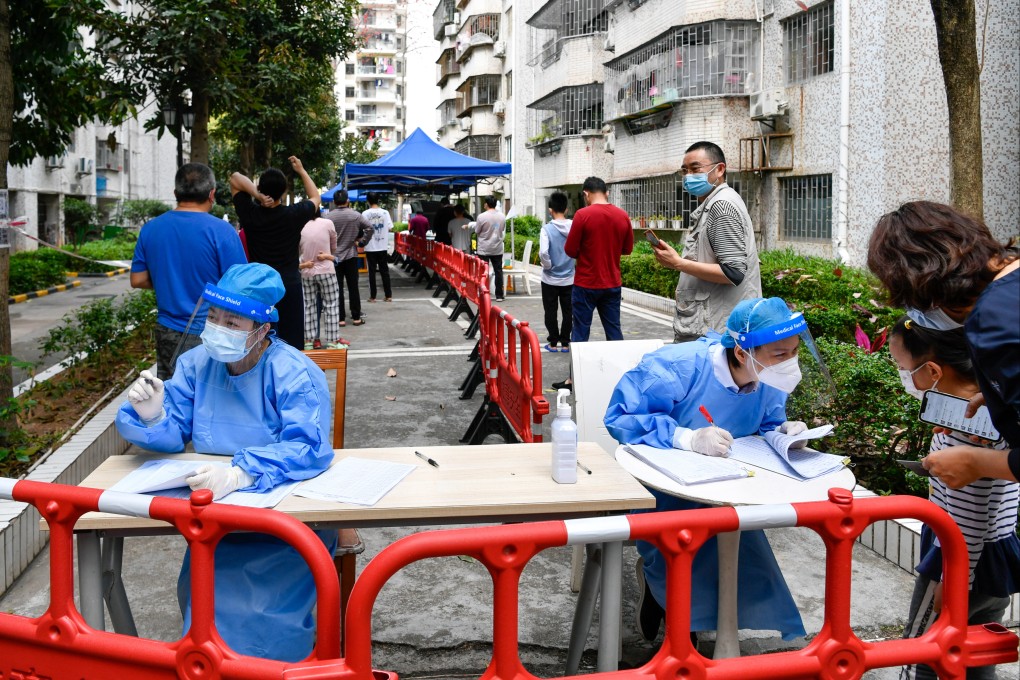 Health workers carry out checks prior to mass nucleic acid tests in Shenzhen in March. Photo: Xinhua