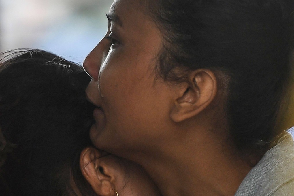 Relatives of passengers on board a missing aircraft in Nepal wait for news. Photo: AFP