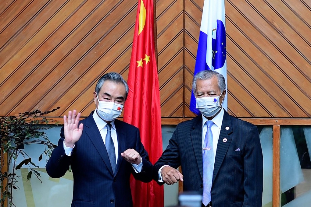 Chinese Foreign Minister Wang Yi with Pacific Islands Forum secretary-general Henry Puna in Fiji’s capital city of Suva. Photo: AFP