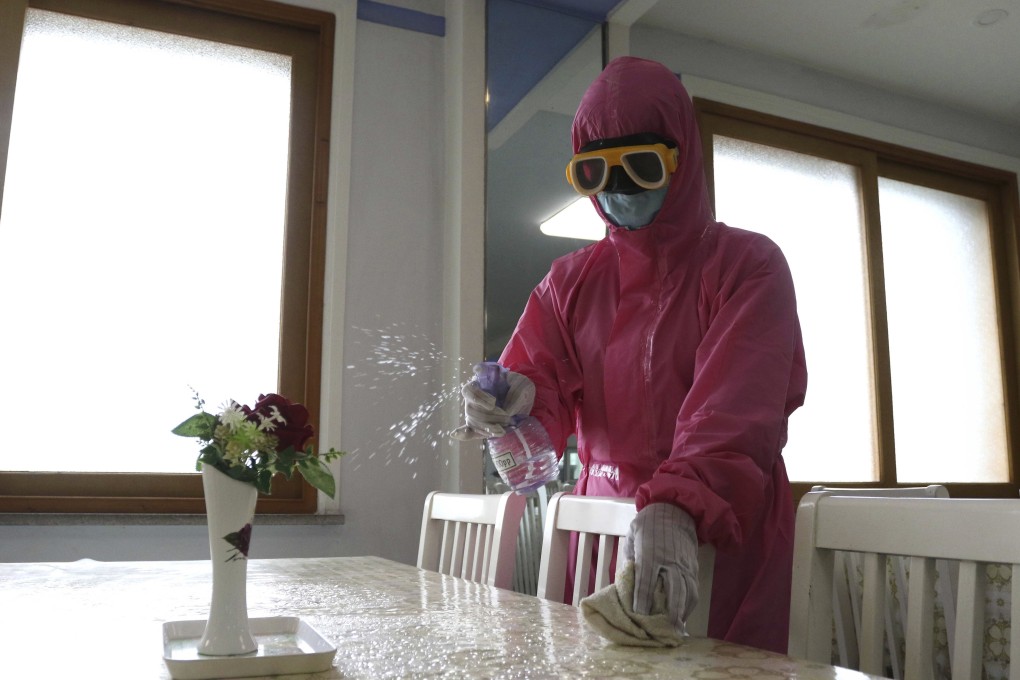 An employee of Pyongyang Dental Hygiene Products Factory disinfects the floor of a dinning room as the state increased measures to stop the spread of illness in Pyongyang, North Korea
Photo: AP