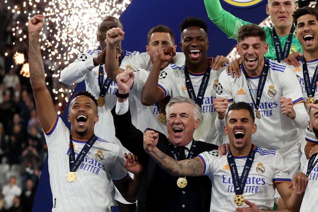 Real Madrid coach Carlo Ancelotti celebrates with his players after winning the Champions League at Stade de France. Photo: Reuters