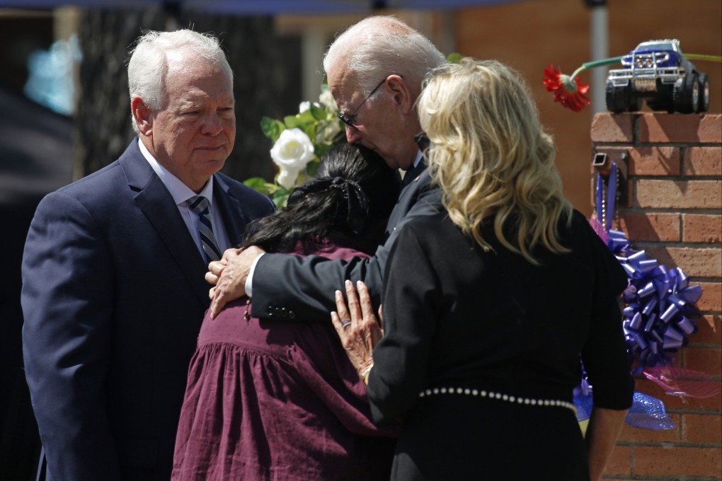 President Joe Biden and first lady Jill Biden comfort Principal Mandy Gutierrez as Superintendent Hal Harrell stands next to them, at a memorial outside Robb Elementary School. Photo: AP