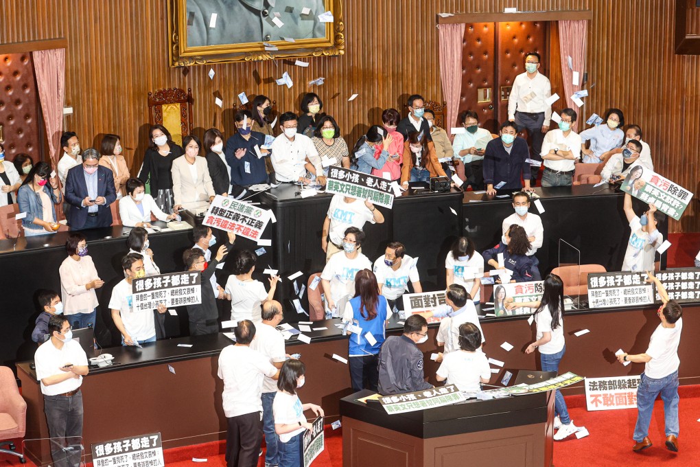 Kuomintang lawmakers protest in Taiwan’s legislature on Monday over changes to the accounting act. Photo: CNA
