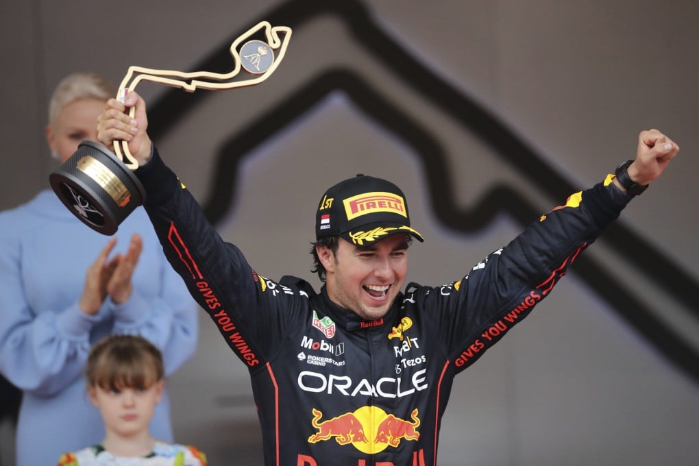 Red Bull driver Sergio Perez of Mexico celebrates on the podium after winning the Monaco F1 Grand Prix. Photo: AP