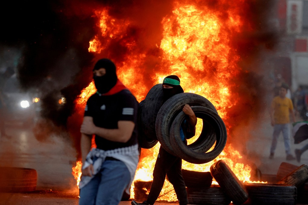 Fires burn amid clashes between Palestinians and Israeli forces over tensions in Jerusalem’s Al-Aqsa Mosque, near the Israeli settlement of Beit El in the Israeli-occupied West Bank. Photo: Reuters