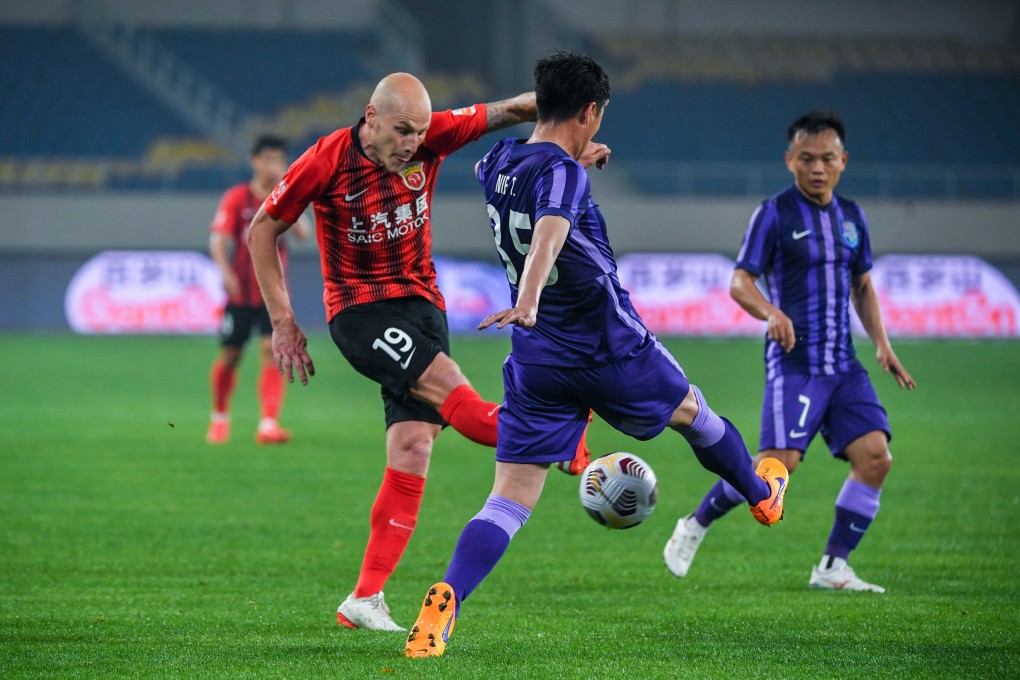 Aaron Mooy (left) may be missing when Shanghai Port begin the delayed Chinese Super League season. Photo: Xinhua