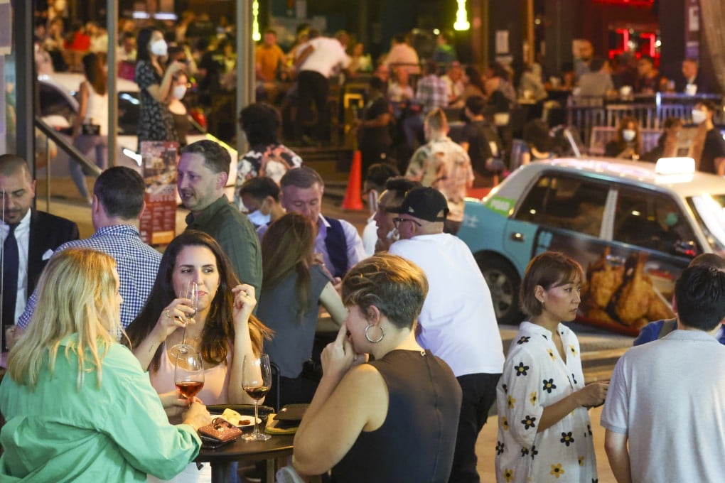 Pub patrons at Hong Kong’s Lan Kwai Fong nightlife district enjoy relaxed rules under a second-phase easing of curbs. Photo: Yik Yeung-man