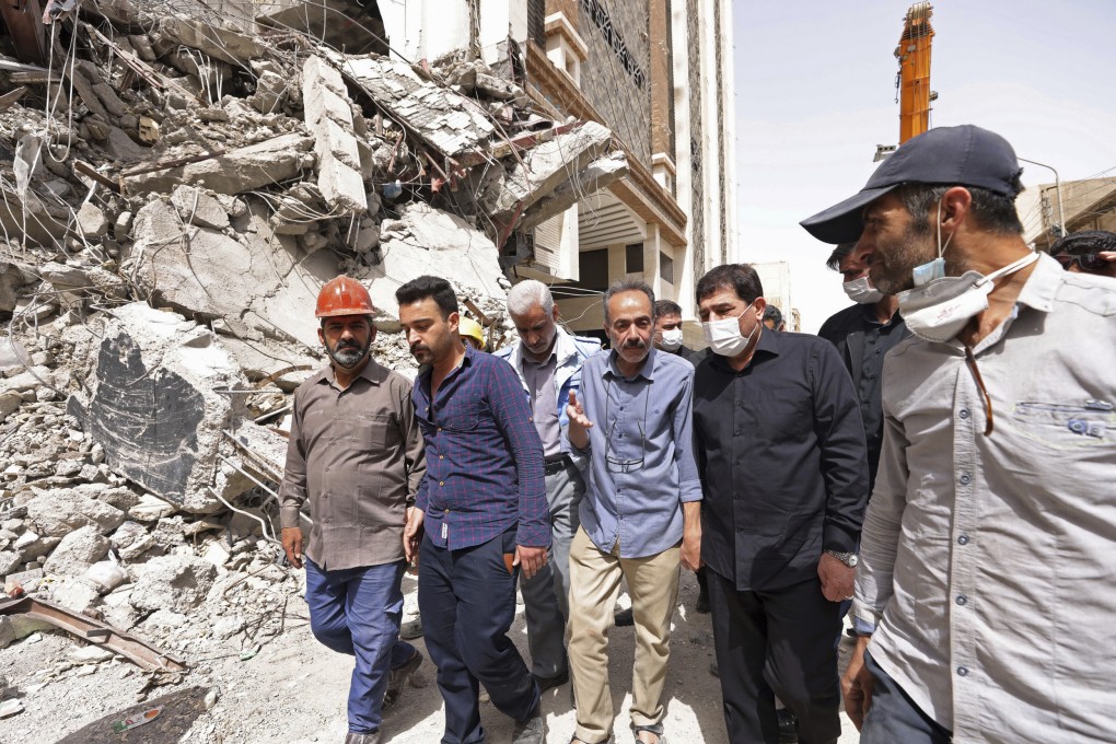 Iranian Vice-President Mohammad Mokhber, second right, visits the site of a tower on Friday at the 10-storey Metropol Building which collapsed on May 23 in Abadan, Iran, killing at least 34 people. Iran disrupted internet access to the outside world on Tuesday as angry demonstrators rallied over the tower collapse. Photo: Iranian Senior Vice-President Office via AP