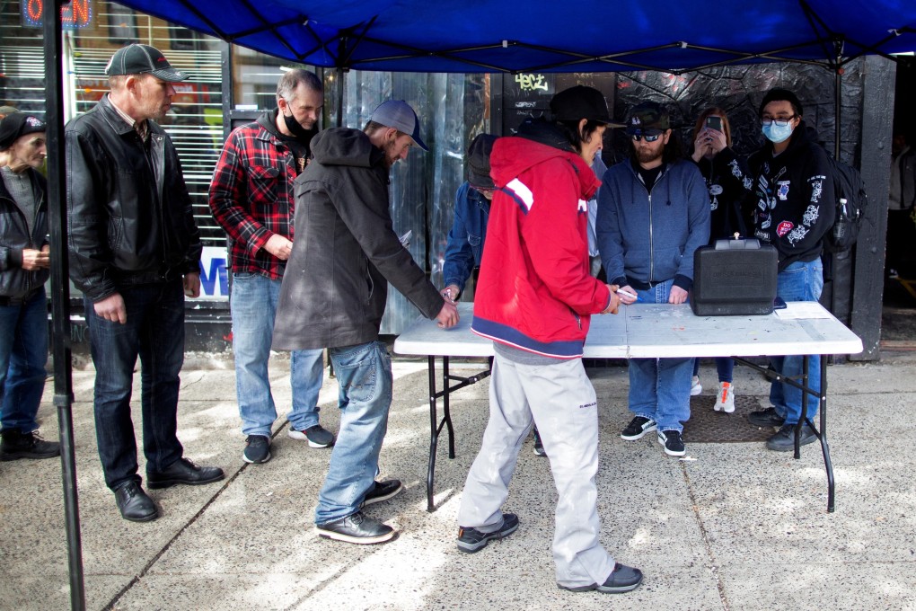 Community members from the Drug User Liberation Front hand out clean, tested doses of drugs in Vancouver, British Columbia, Canada on April 14. Photo: Reuters