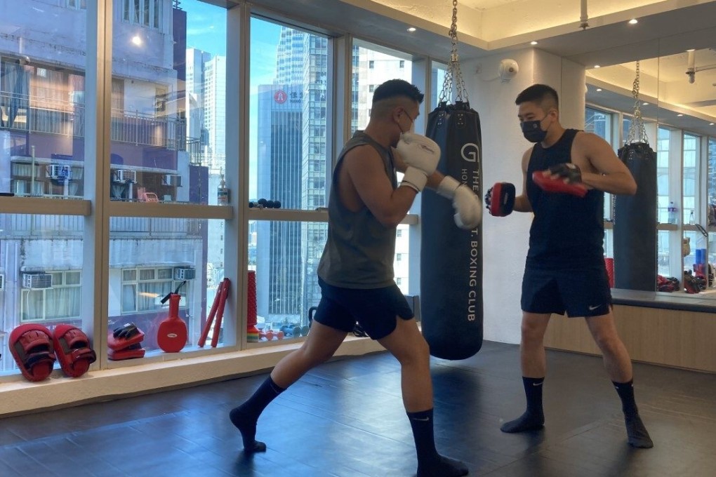 Leslie Wong (left) warms up with Sunny Ip before their afternoon session begins at G.O.A.T Boxing Club in Central. Photo: Kim Bo-eun