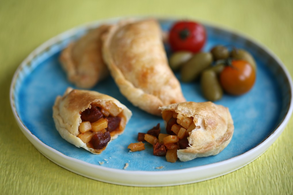 Empanadas with cream cheese pastry, filled with a mix of potatoes, Spanish chorizo and onion. Photo: Jonathan Wong