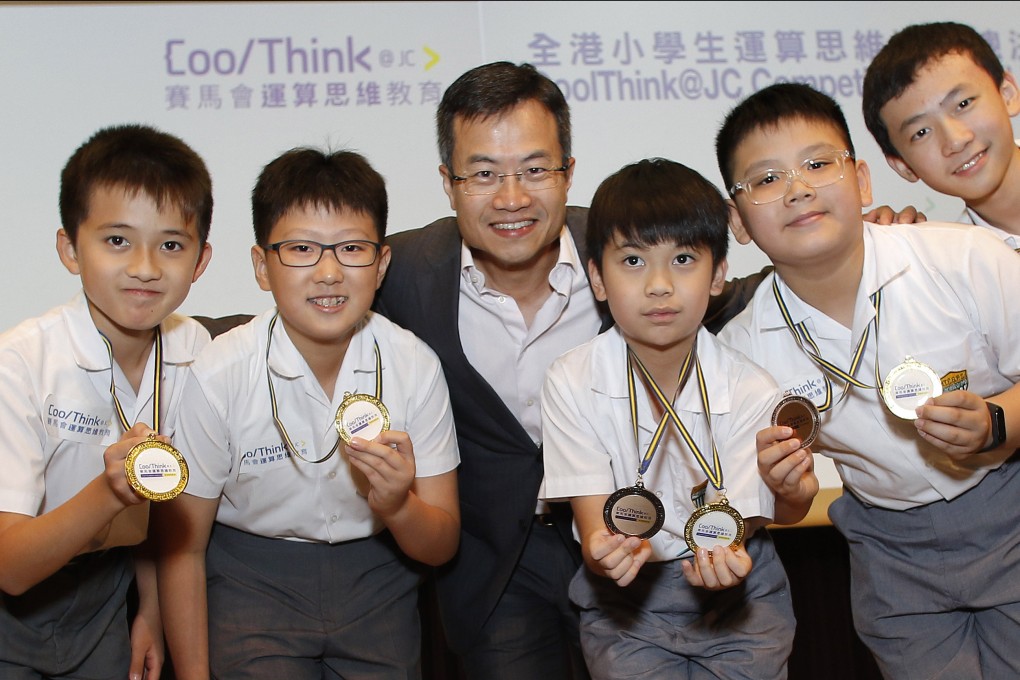 Leong Cheung, Executive Director of Charities & Community at The Hong Kong Jockey Club, presented awards to the winning team of the annual CoolThink@JC Competition. He says the programme helps prepare students for an I&T economy. This photograph was taken before the pandemic. Photo: HKJC