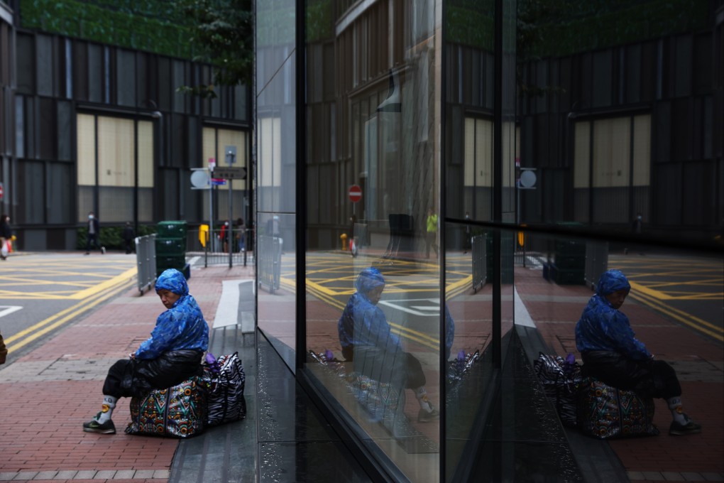 An underemployed worker rests in Causeway Bay during the fifth wave of the pandemic, on March 29. Nora Tam