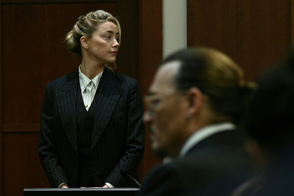 Amber Heard and Johnny Depp watch as the jury comes into the courtroom after a lunch break at the Fairfax county circuit courthouse in Virginia on May 17. Photo: AFP