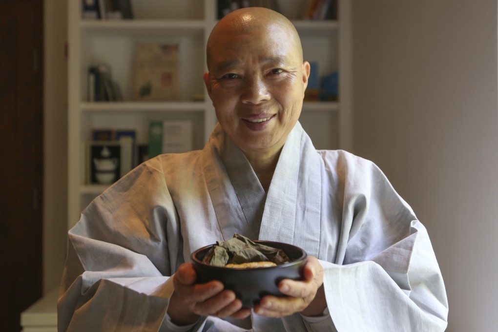 Jeong Kwan, a Korean nun chef, presents lotus leaf wrapped dumplings at the Asia Society in Hong Kong in  2017. She and another nun have bene named Masters of Korean Temple Food. Photo: Xiaomei Chen