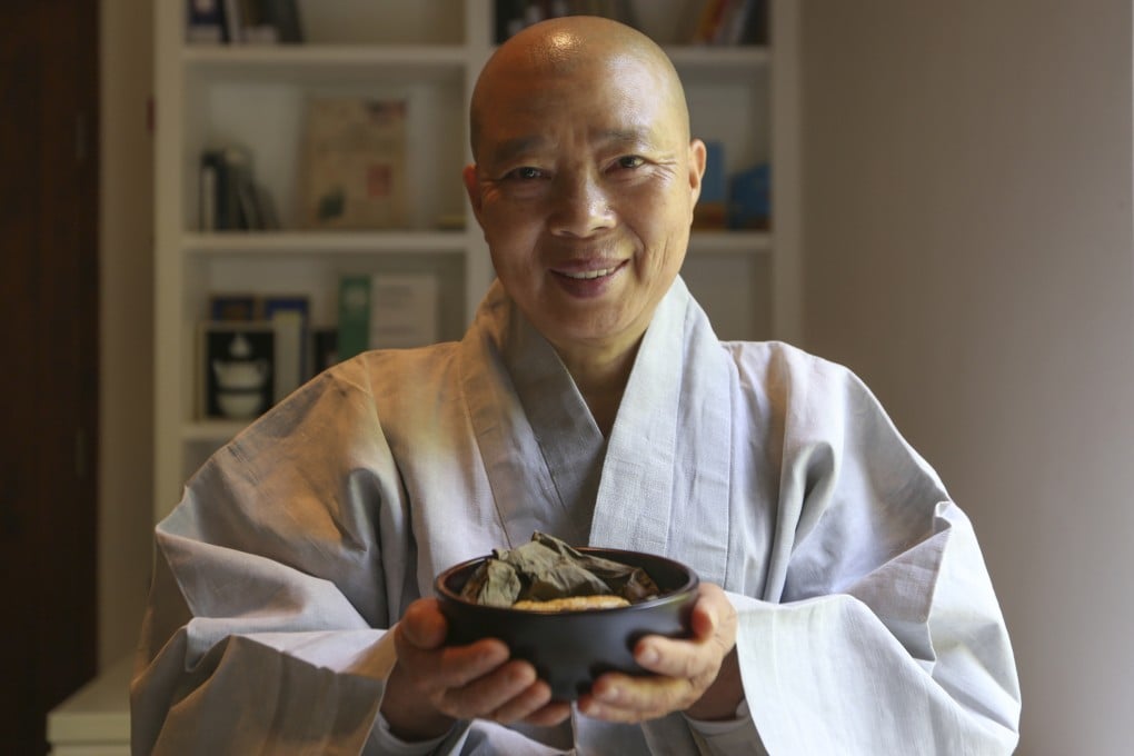 Jeong Kwan, a Korean nun chef, presents lotus leaf wrapped dumplings at the Asia Society in Hong Kong in 2017. She and another nun have bene named Masters of Korean Temple Food. Photo: Xiaomei Chen