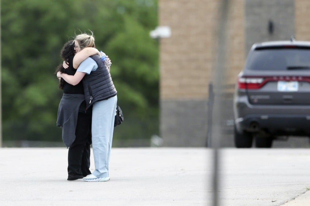 Two people hug as they are reunited after being evacuated from the scene of a shooting at the Natalie Medical Building in Tulsa, Oklahoma, on Wednesday. Photo: Tulsa World via AP