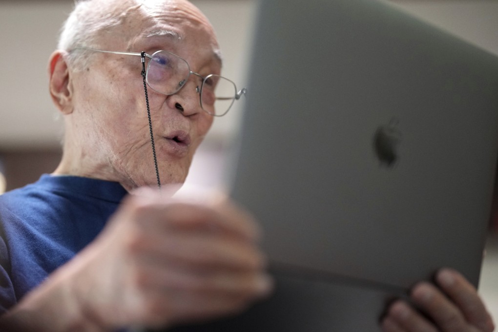 Japanese poet and translator Shuntaro Tanikawa reads a poem during an interview in Tokyo on May 25, 2022. Photo: AP