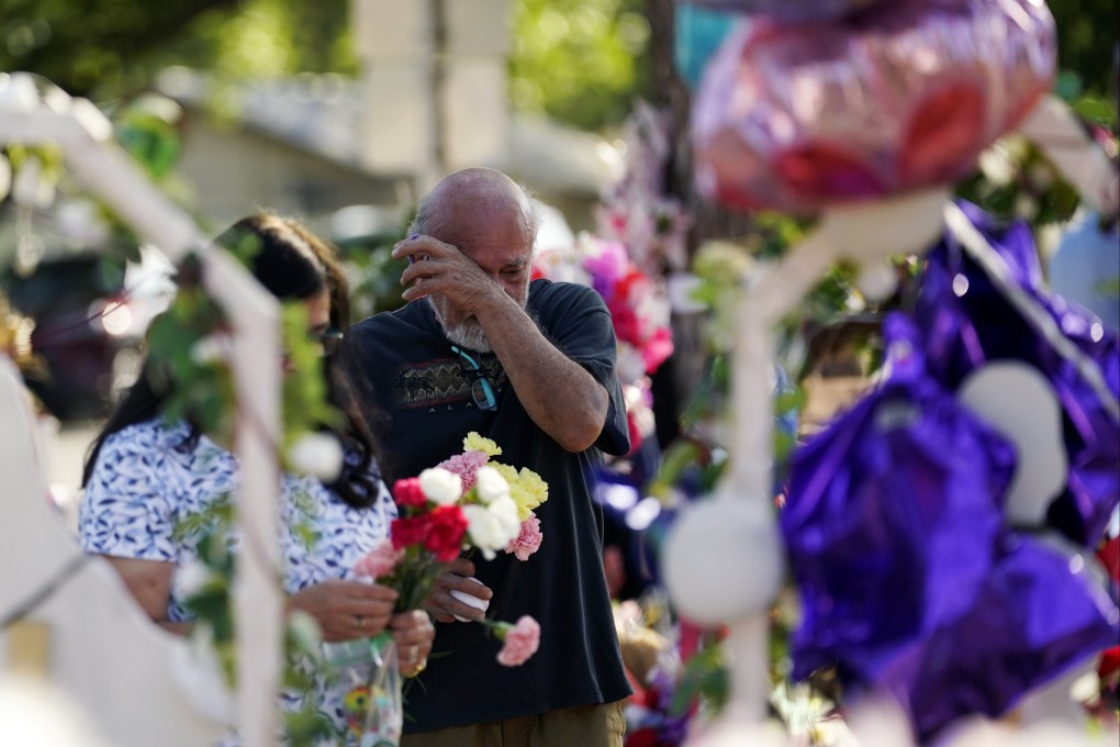 Visitors pay their respects at a memorial created to honour the victims of last week’s school shooting in Uvalde, Texas. Photo: AP