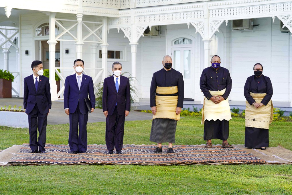 King Tupou VI of Tonga (third from right) and Chinese Foreign Minister Wang Yi (third from left) at the Royal Palace Nukualofa on Tuesday. Photo: AFP