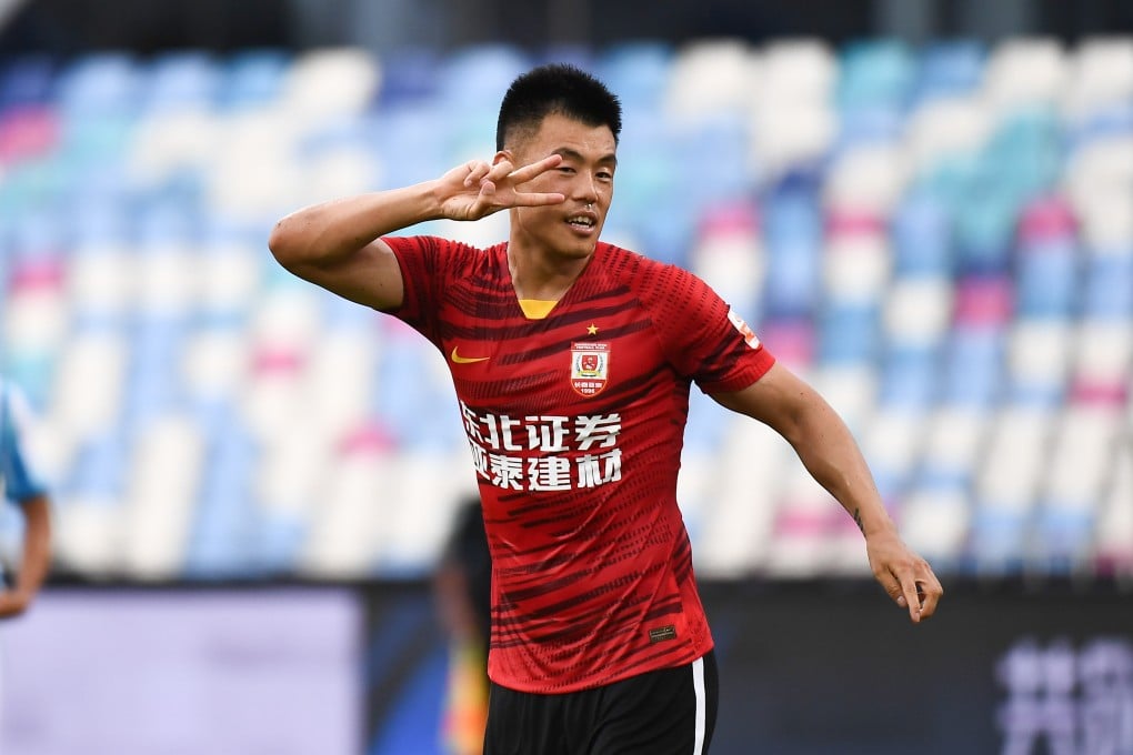 Changchun Yatai’s Tan Long celebrates scoring against Guangzhou City in Haikou. Photo: Xinhua