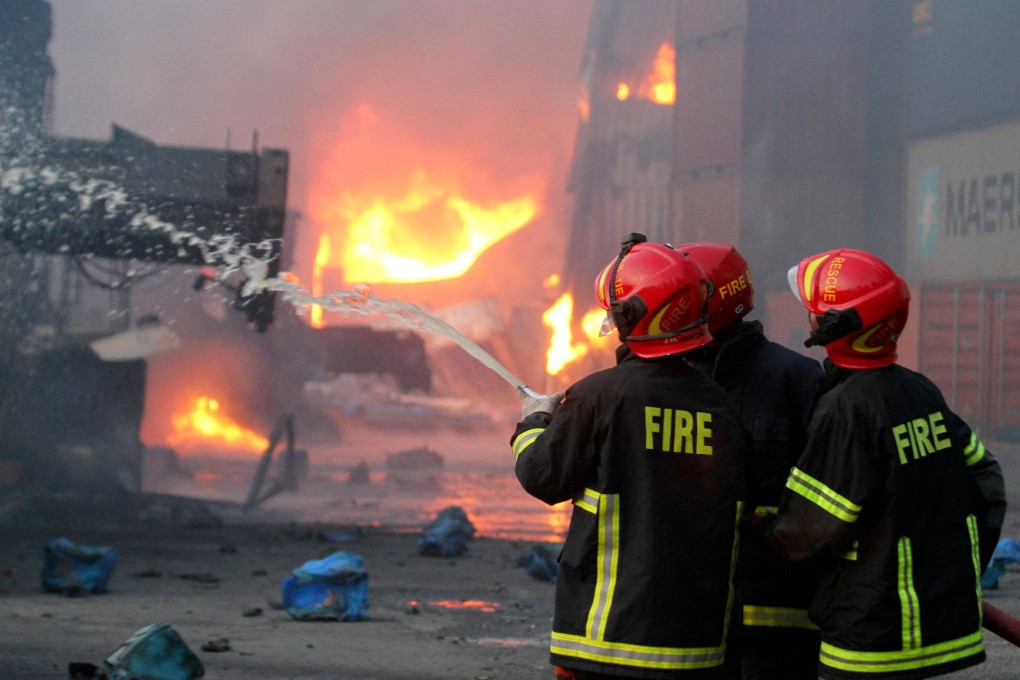 Firefighters try to extinguish the fire that broke out at the container storage facility in Bangladesh. Photo: AFP