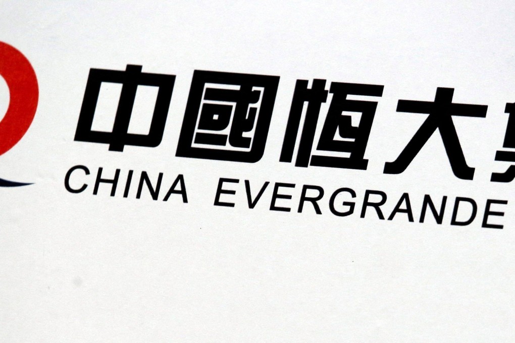 The logo of China Evergrande Group is displayed at a news conference. Photo: Reuters