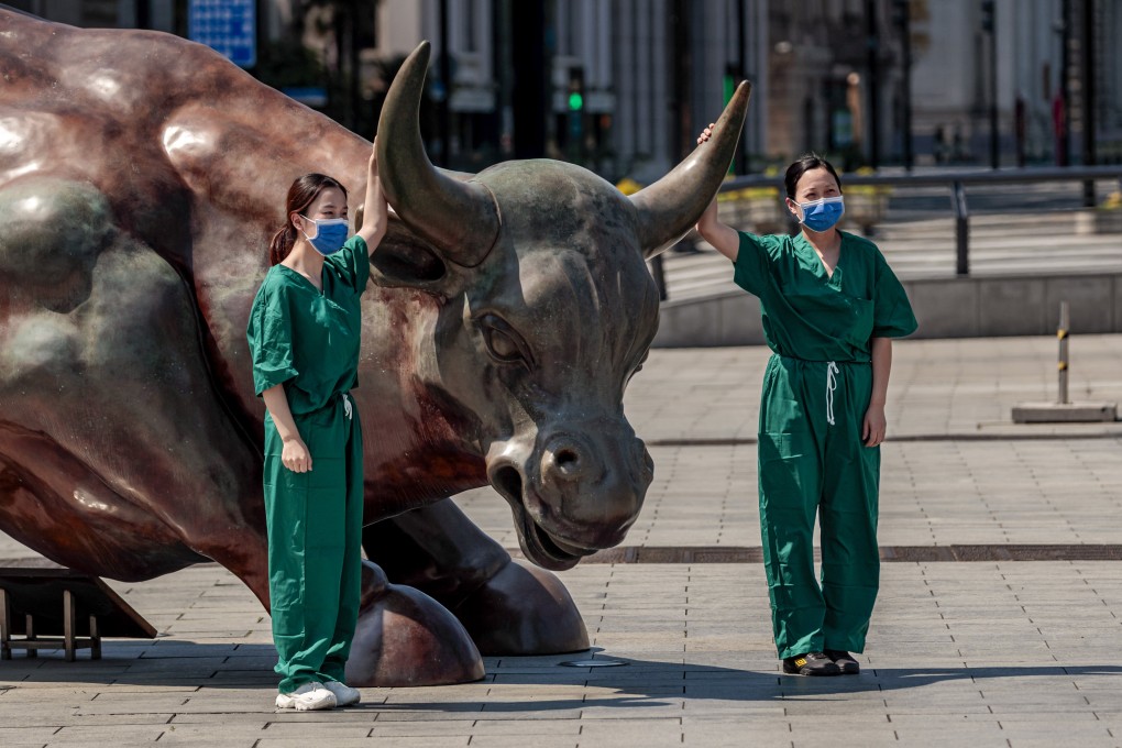 Volunteers pose for a picture during the Covid-19 lockdown in Shanghai, on May 5, 2022. The city’s reopening should help internet, car and consumer stocks outperform in the near term, according to Julius Baer. Photo: EPA-EFE