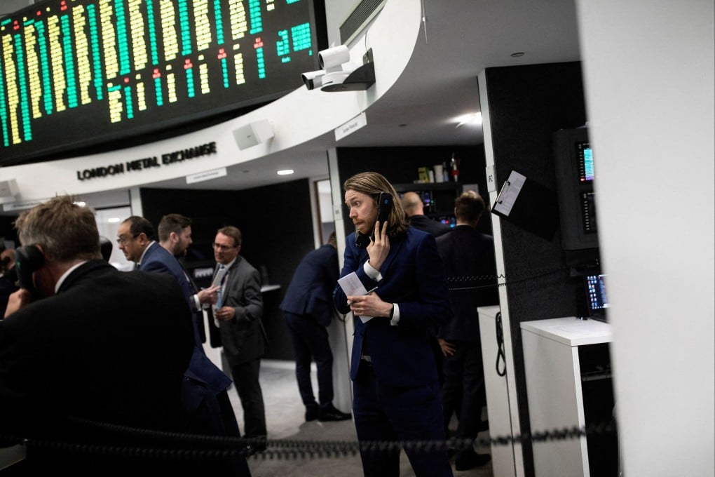 Traders work on the floor of the London Metal Exchange. Photo: Reuters