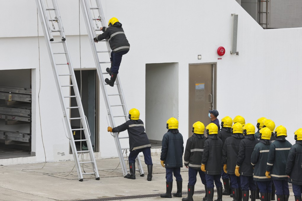 Firefighters during a training exercise at the Fire and Ambulance Services Academy in Tseung Kwan O. Photo:  Edmond So