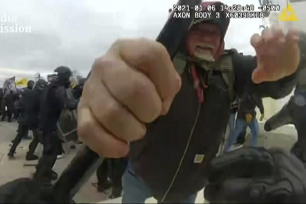 The committee played a graphic video of the Capitol breach. Photo: AP