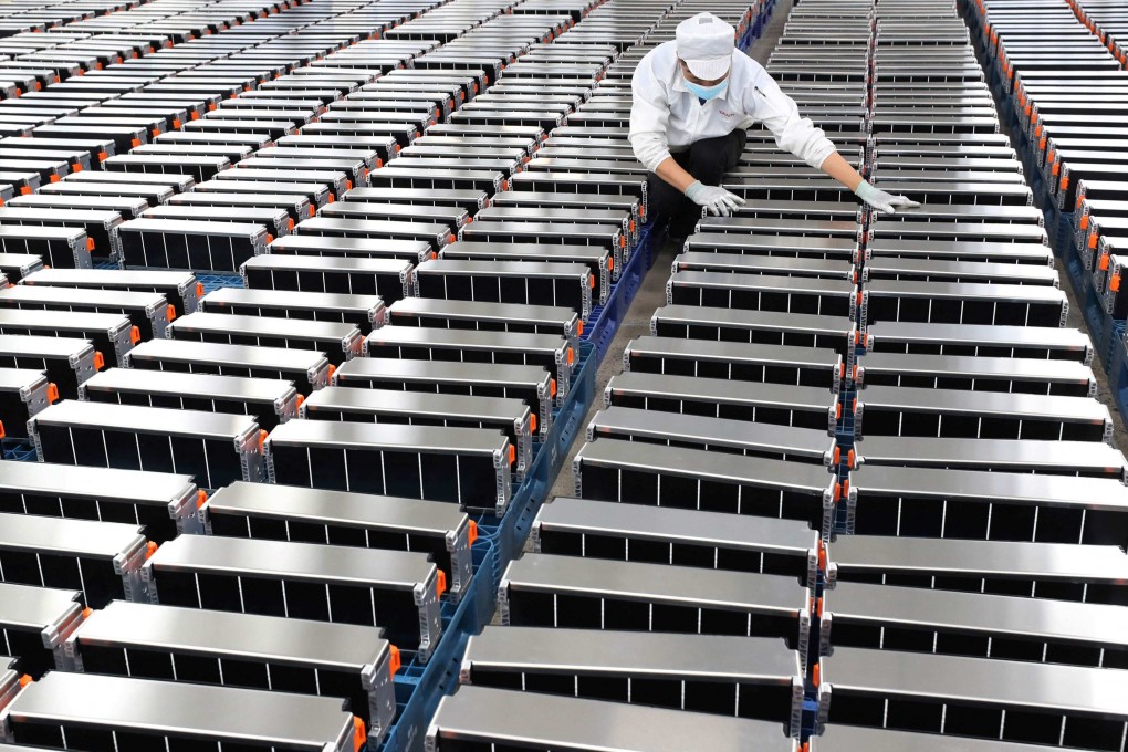 A worker tends to car batteries at a factory for Xinwangda Electric Vehicle Battery Co. in Nanjing, Jiangsu province. China dominates global production of advanced batteries. Photo: STR/AFP