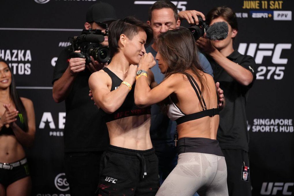 Zhang Weili (left) and Joanna Jedrzejczyk square off at the UFC 275 weigh-ins in Singapore. Photo: Zuffa/Getty Images.