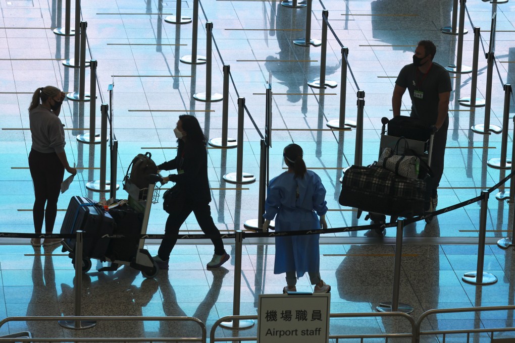 Passengers at Hong Kong’s airport. International travellers can come into the city but are subject to a seven-day hotel quarantine. Photo: Edmond So