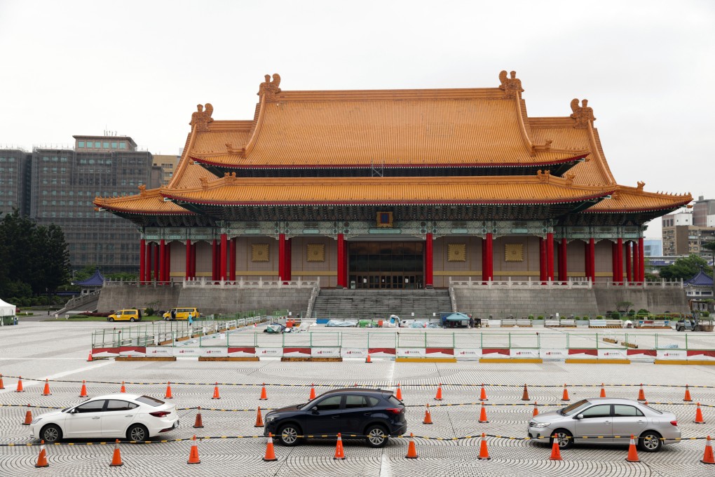 Vehicles queue at a drive-through Covid-19 testing facility set up at Liberty Square in Taipei, Taiwan. Photo: Bloomberg