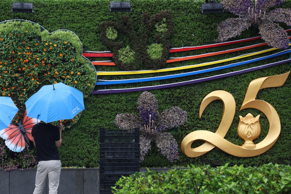 Pedestrians pass by an art installation set up at Victoria Park in Causeway Bay, to celebrate the 25th anniversary of Hong Kong handover to China. Photo: Yik Yeung -man