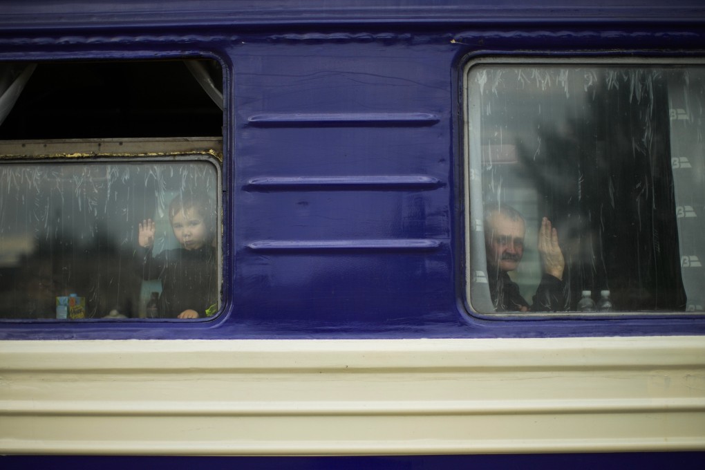 People fleeing from heavy shelling depart in an evacuation train in eastern Ukraine in May. Photo: AP