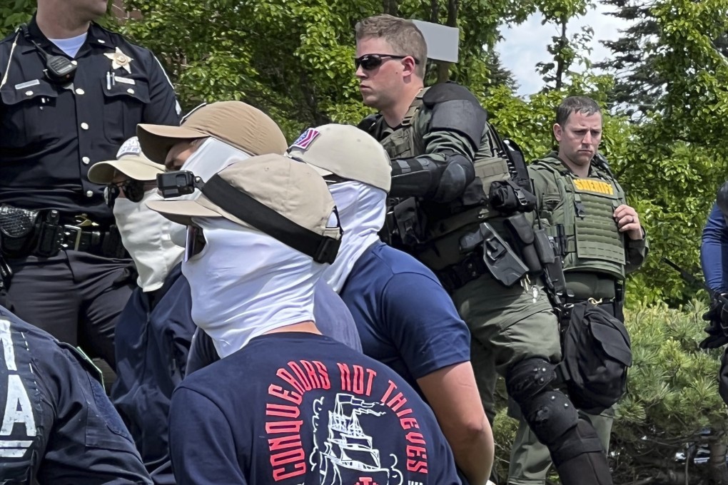 Members of the white supremacist group Patriot Front are arrested near an Idaho pride event. Photo: AP