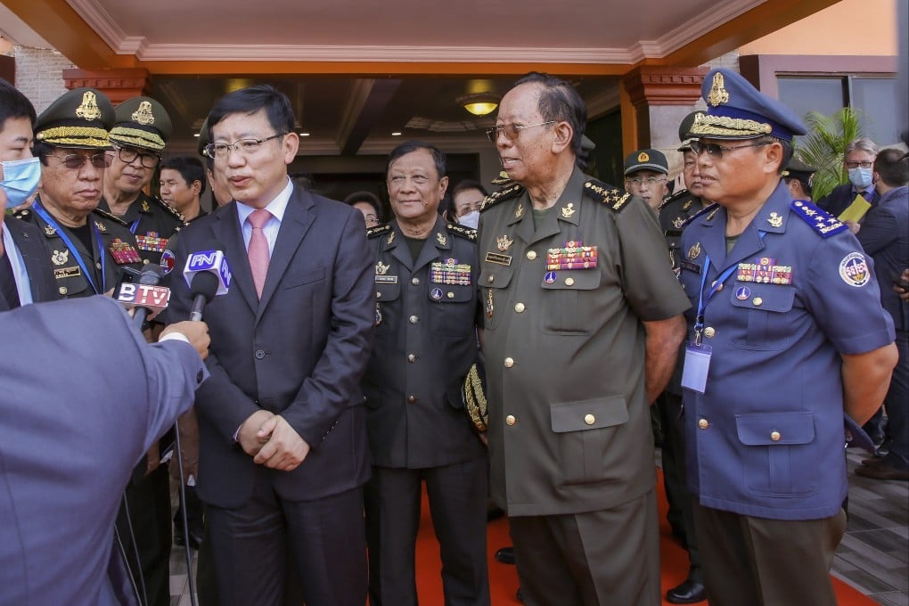 Chinese Ambassador to Cambodia Wang Wentian, front center left, talks to reporter as Cambodian Defense Minister Tea Banh, second from right, listens during the groundbreaking ceremony for a shipyard repairing and restoration workshop in Ream Cambodian Naval Base of Sihanoukville, this month. Photo: AP