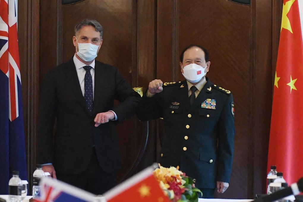 Australian Defence Minister Richard Marles (left) meets his Chinese counterpart Wei Fenghe on the sidelines of the Shangri-La Dialogue in Singapore on Sunday. Photo: Australian Department of Defence